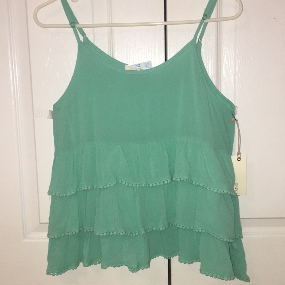 Tank top w/ ruffles.
